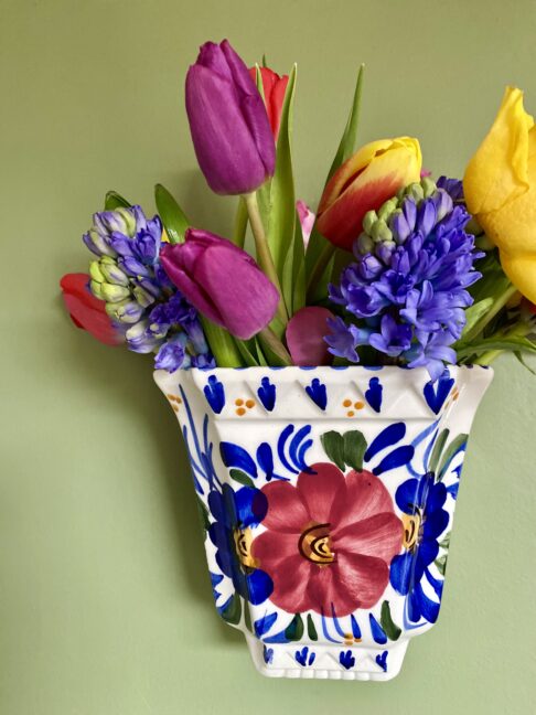 Pretty wall vase with flower design.