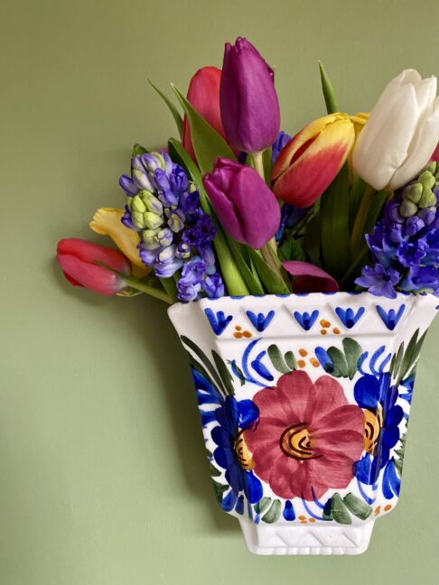 A pretty, vintage wall pocket for flowers.