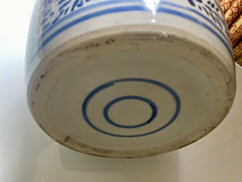 The base of a vintage Chinese ginger jar with lid.