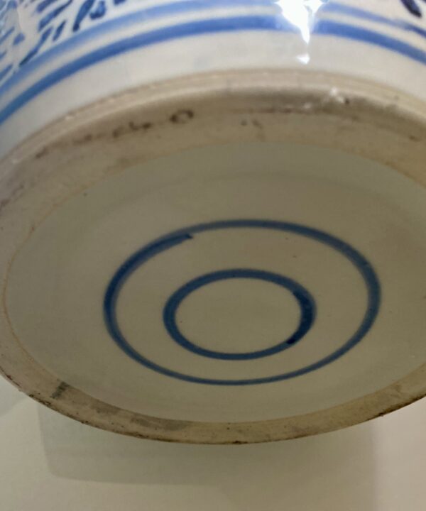 The base of a vintage Chinese ginger jar with lid.