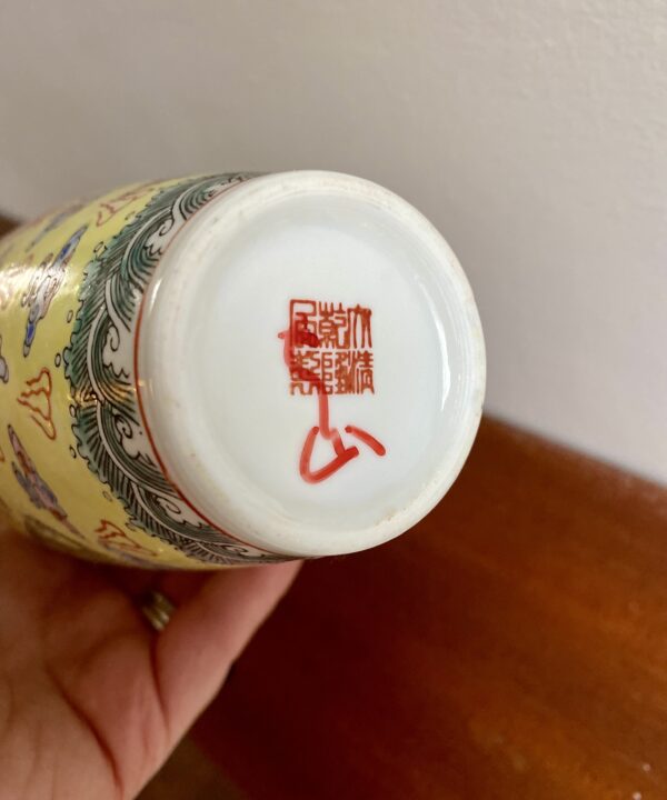 The back stamp on a delicate porcelain Chinese vase.