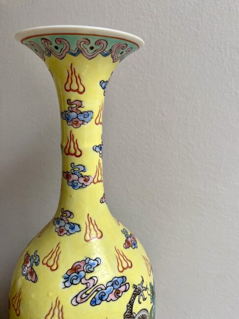 The slim neck of a vintage Chinese bottle vase.