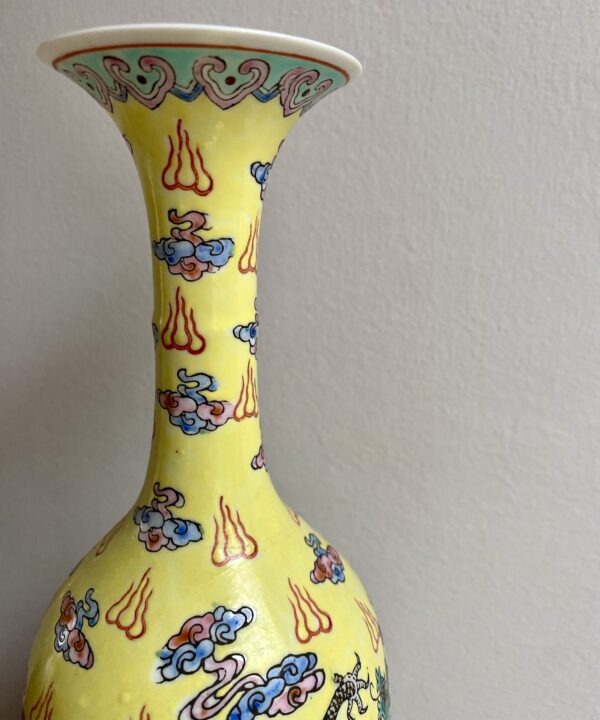 The slim neck of a vintage Chinese bottle vase.