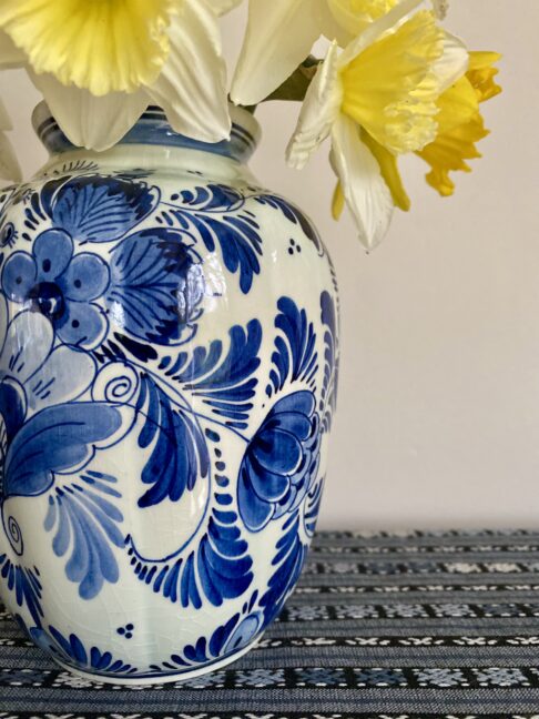 Daffodils in a pretty, vintage blue and white flower vase.