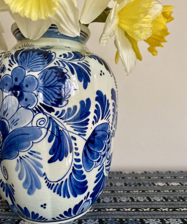 Daffodils in a pretty, vintage blue and white flower vase.