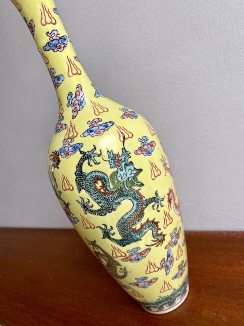 The dragon detail on a delicate porcelain Chinese bottle.