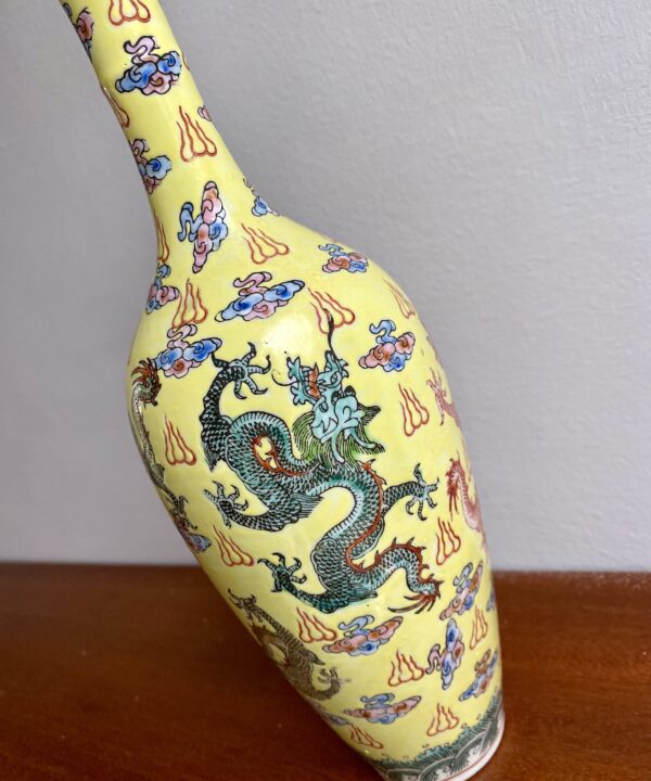 The dragon detail on a delicate porcelain Chinese bottle.