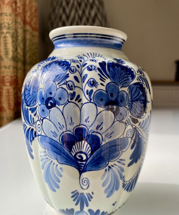 A pretty Delft vase with hand-painted flowers.