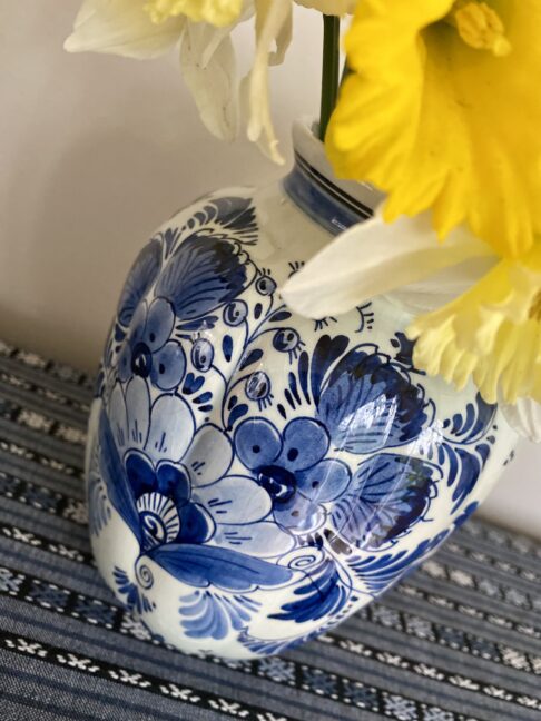 Daffoldils adorning a pretty blue and white china vase from Holland.