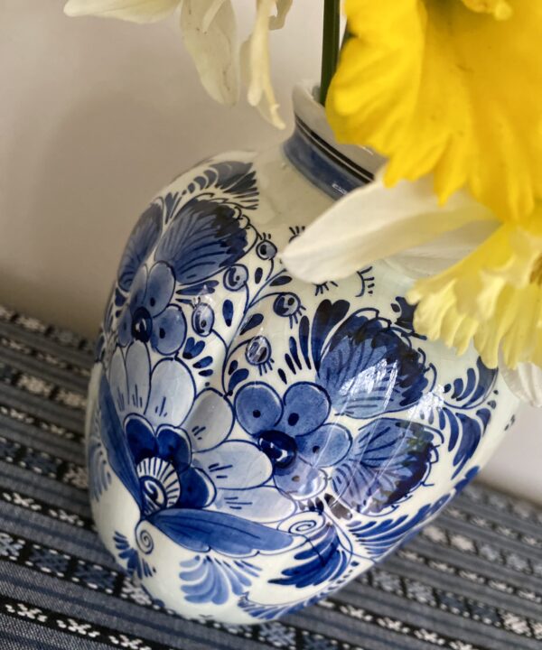 Daffoldils adorning a pretty blue and white china vase from Holland.