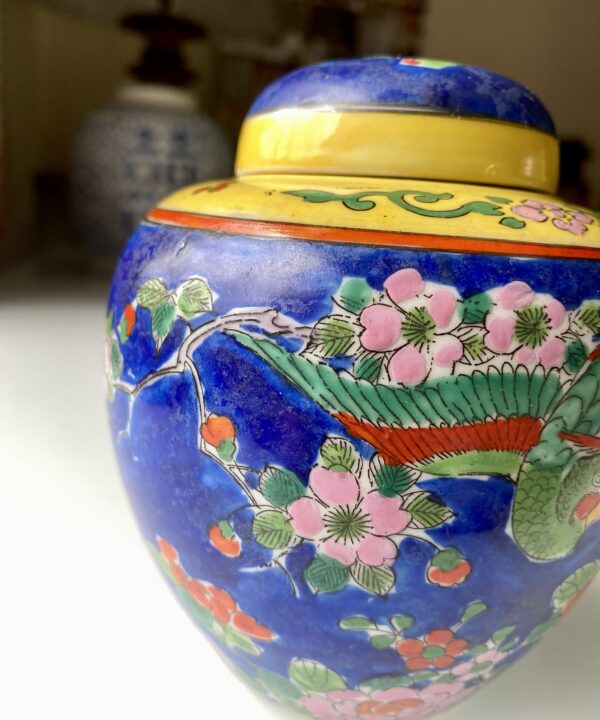 Bright primary colours on a vintage pottery jar from Japan.