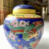 Brightly-coloured vintage Japanese pottery jar with lid