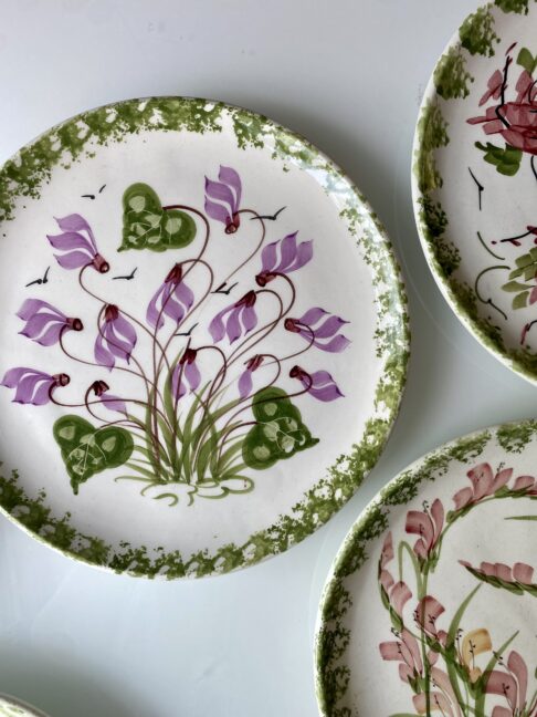Pretty purple flowers on a vintage wall plate.