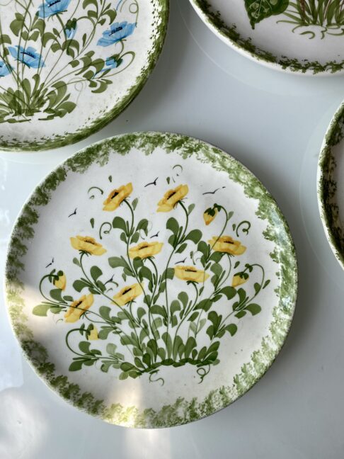 Yellow flowers on a hand-painted plate handmade in Cyprus.