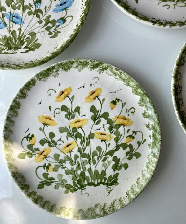 Yellow flowers on a hand-painted plate handmade in Cyprus.