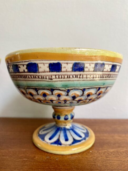 A charming, footed and hand-painted small dish.