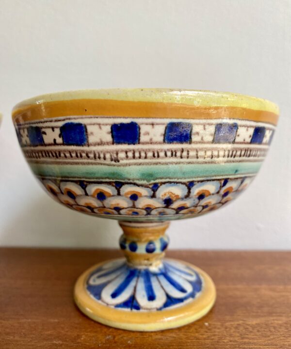 A charming, footed and hand-painted small dish.