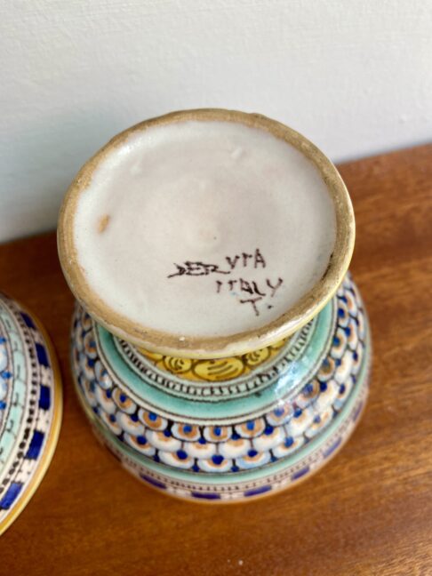 The pottery back stamp on an Italian footed dish.