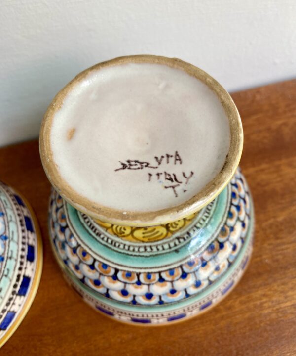 The pottery back stamp on an Italian footed dish.
