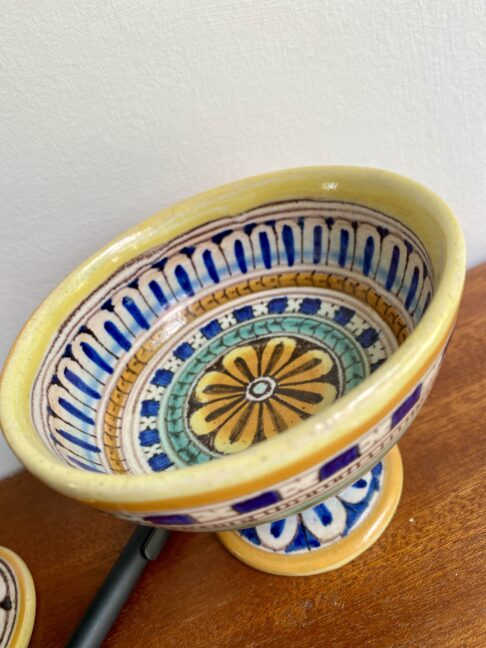 A decorative small footed dish handmade in Italy.
