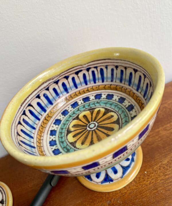 A decorative small footed dish handmade in Italy.
