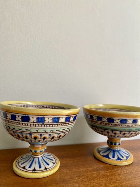 Handmade Italian ceramic dishes in blue and yellow.