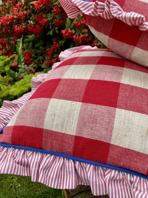 Red plaid cushions made from vintage French linen.