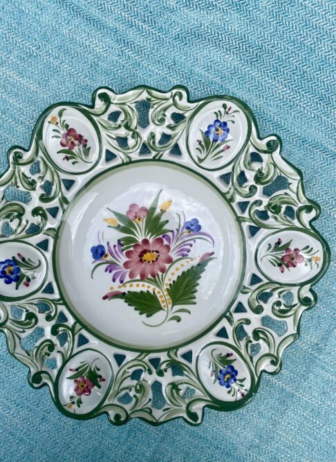 A large, sectional, decorative wall plate adorned with flowers. Handmade in Portugal.
