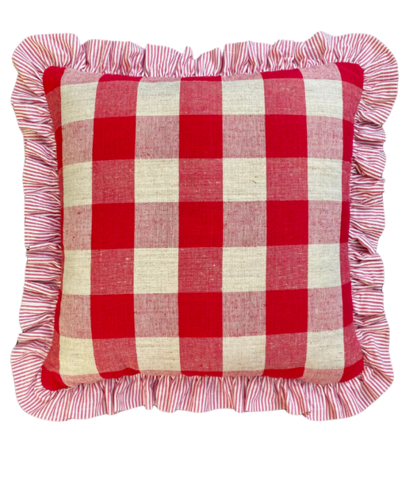 A red and white check cushion in French vintage linen with a striped frill.