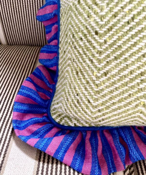Pretty frilled cushions in linen and tweed.