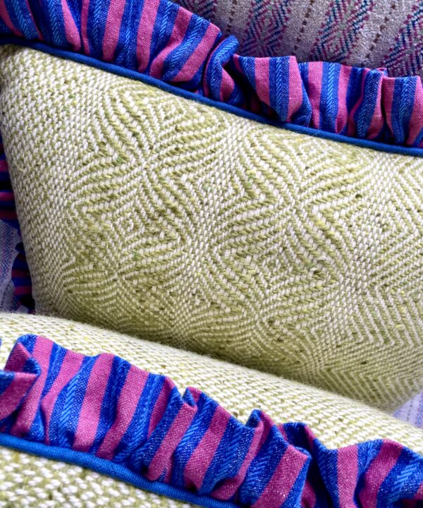 Handmade tweed cushions with linen frilled trim.