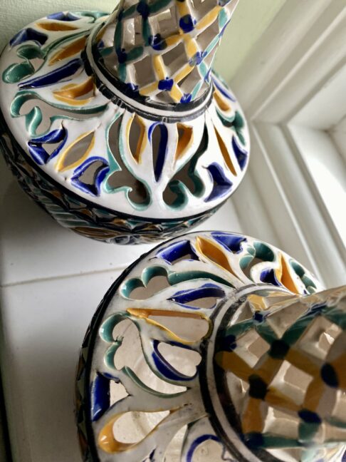 Handmade pots with pierced detailing.
