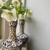 A pair of hand-painted vintage vases with pierced decoration.