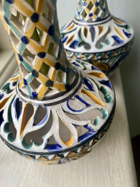 Vintage vases detail showing a yellow, pale green and blue colour palette.