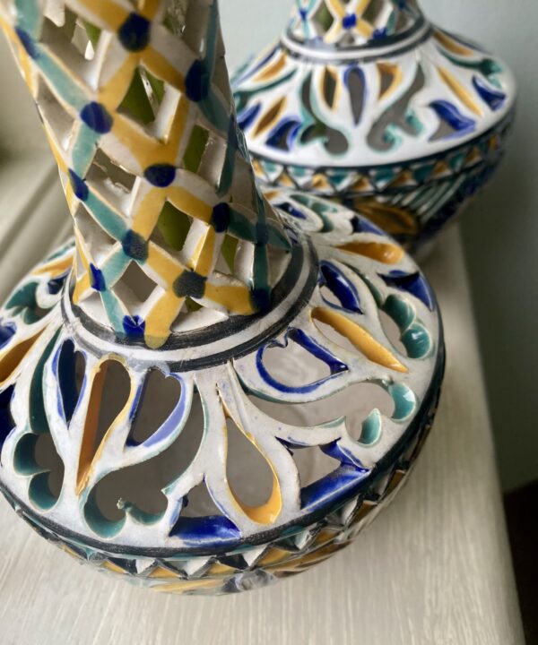Vintage vases detail showing a yellow, pale green and blue colour palette.
