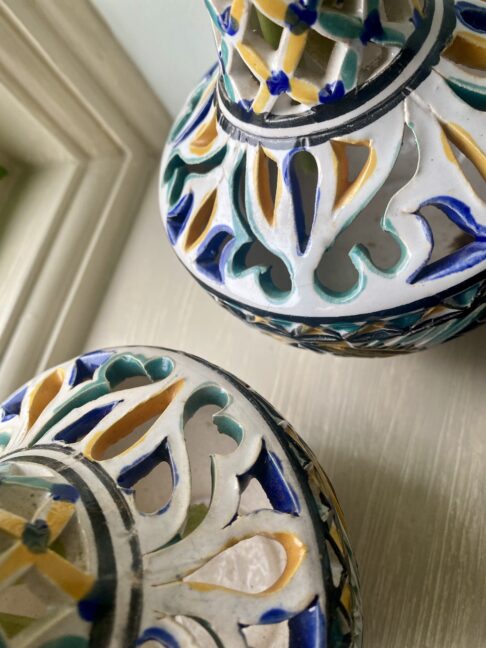 Hand-painted detailing on a pair of vintage vases.
