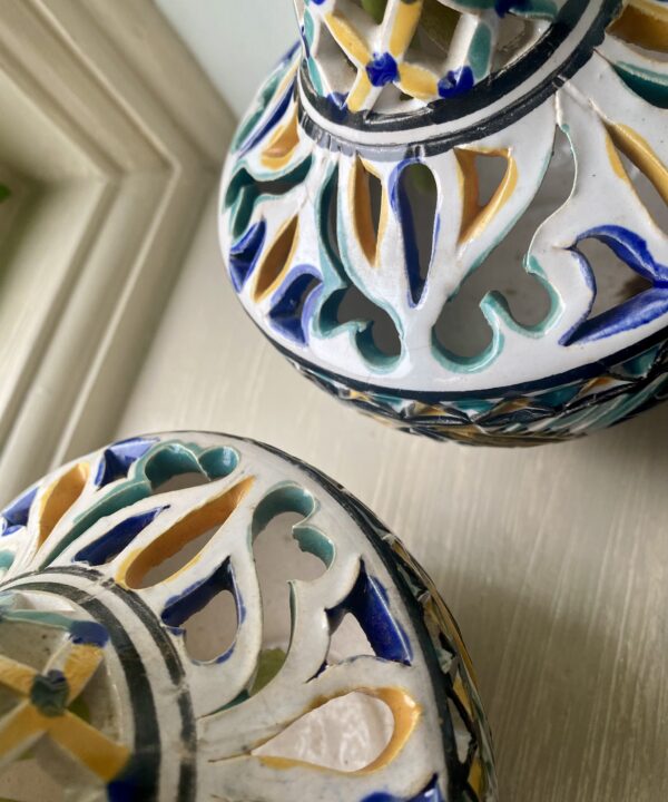 Hand-painted detailing on a pair of vintage vases.