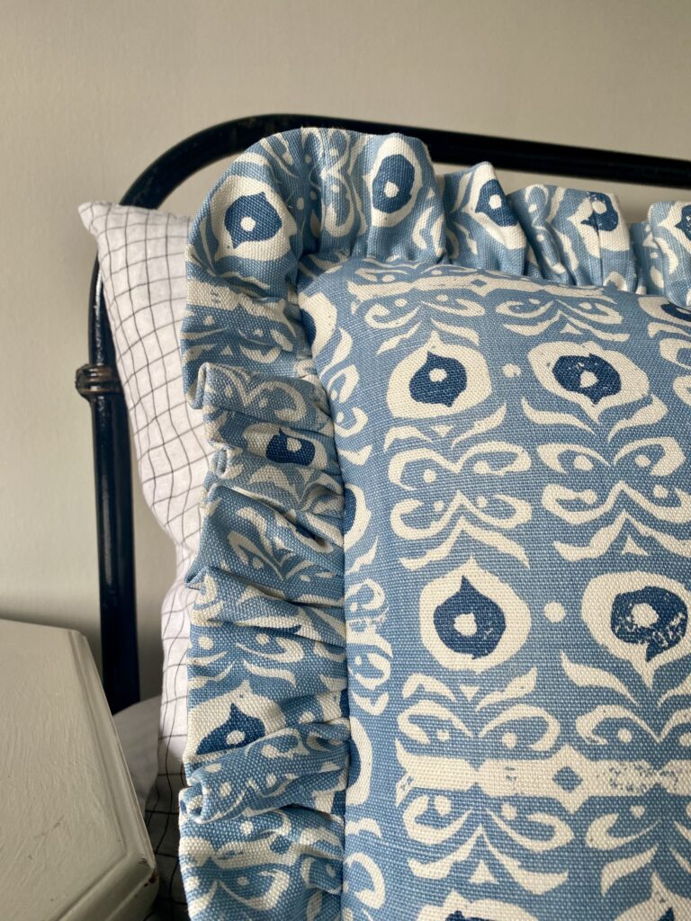 Pale blue frilly cushions in a hand-printed linen.