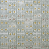 Pale green wallpaper in a lively all-over print in soft celadon and golden yellow tones.