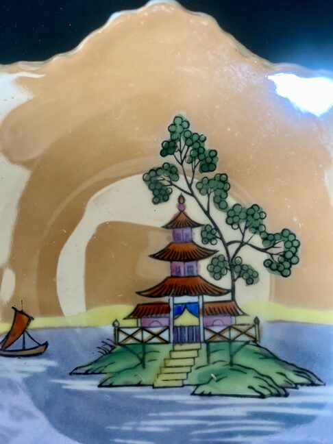 Hand-painted pagoda in rainbow colours on a vintage Japanese dish.