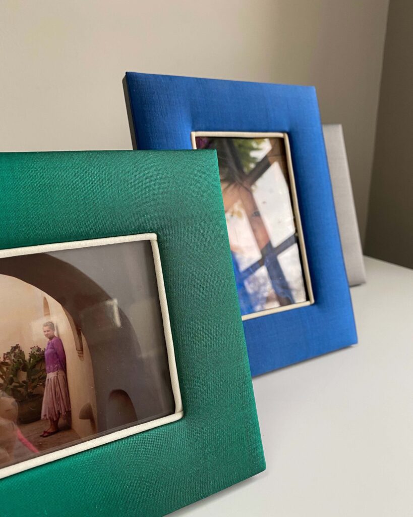 Handmade photograph frames in blue and green Thai silks.
