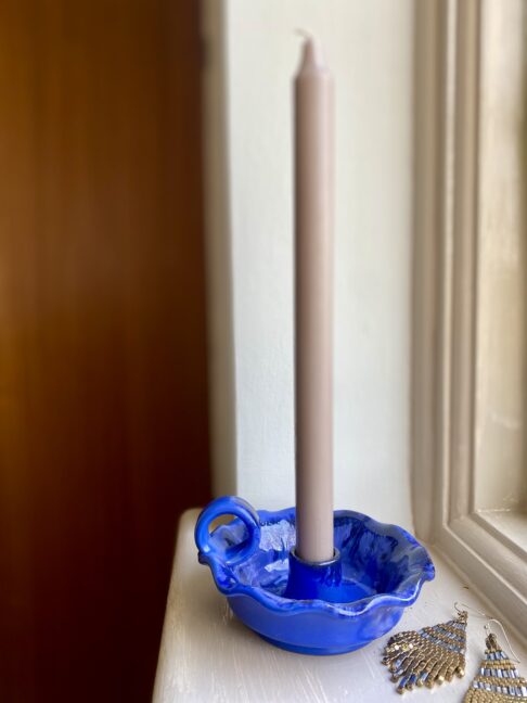 Scalloped-edge candle holder from a Greek pottery.