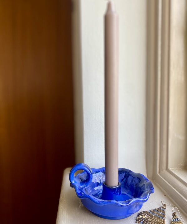 Scalloped-edge candle holder from a Greek pottery.