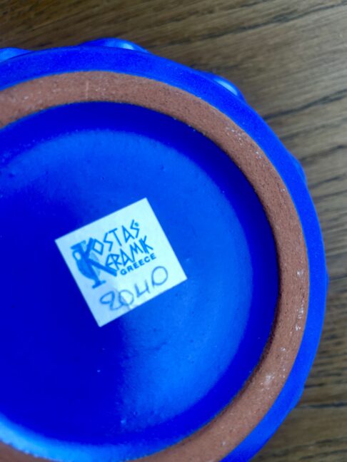 Back stamp on a handmade Greek candle holder in cobalt blue.