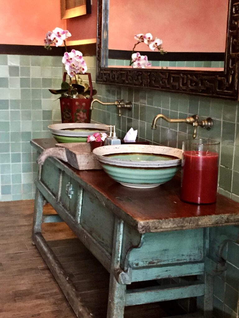 A spa style bathroom with hand-thrown ceramic sinks at a hotel in Thailand.