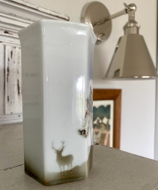 Small, hexagonal pottery bud vase with a stag in a Scottish landscape design.