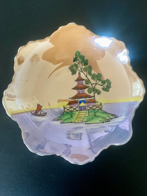 A vintage Japanese trinket dish with colourful lustreware finish.