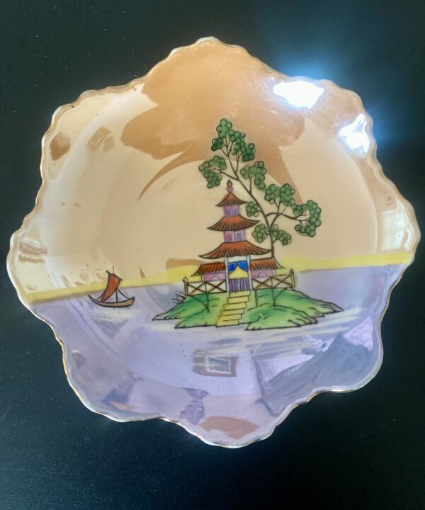 A vintage Japanese trinket dish with colourful lustreware finish.