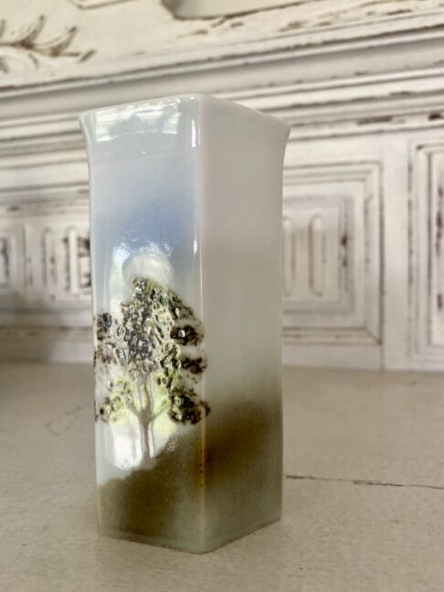 Tree and stag design on a hexagonal pottery bud vase.