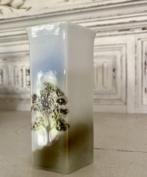 Tree and stag design on a hexagonal pottery bud vase.